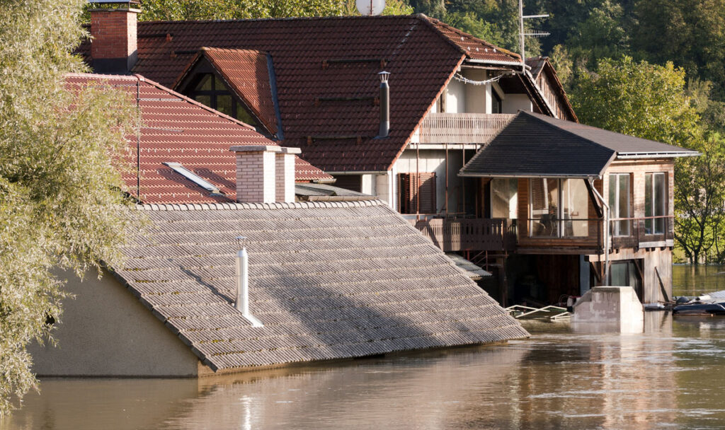Flooding waters of river Sava and Krka in Slovenia, September 2010 with house under water to the roof.